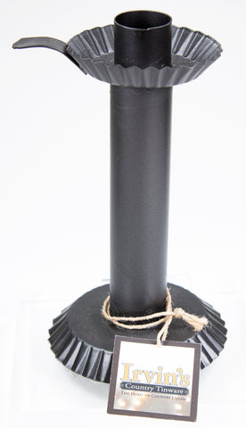 Image of matte black candle stick holder with manufacturer's tag tied around its base
