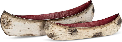 Set of birch canoes in two sizes pictured side by side