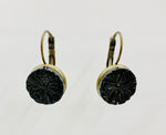 Vintage button hanging earrings with black starburst design