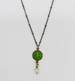 Necklace with vintage green button and crystal drop