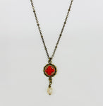 Necklace with vintage red button and crystal drop