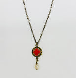 Necklace with vintage red button and crystal drop