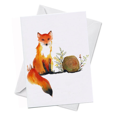 Greeting card with watercolour artwork of a fox beside a log