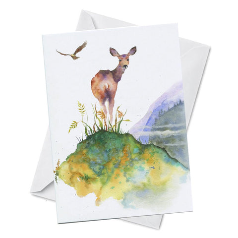 Greeting card with watercolour artwork of a deer on a hill with eagle soaring in the background 