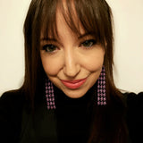 Photo of artist, Tammy Beers, wearing beaded earrings